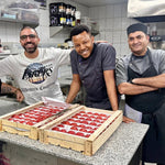 Family cooking meals using fresh premium tomatoes at home